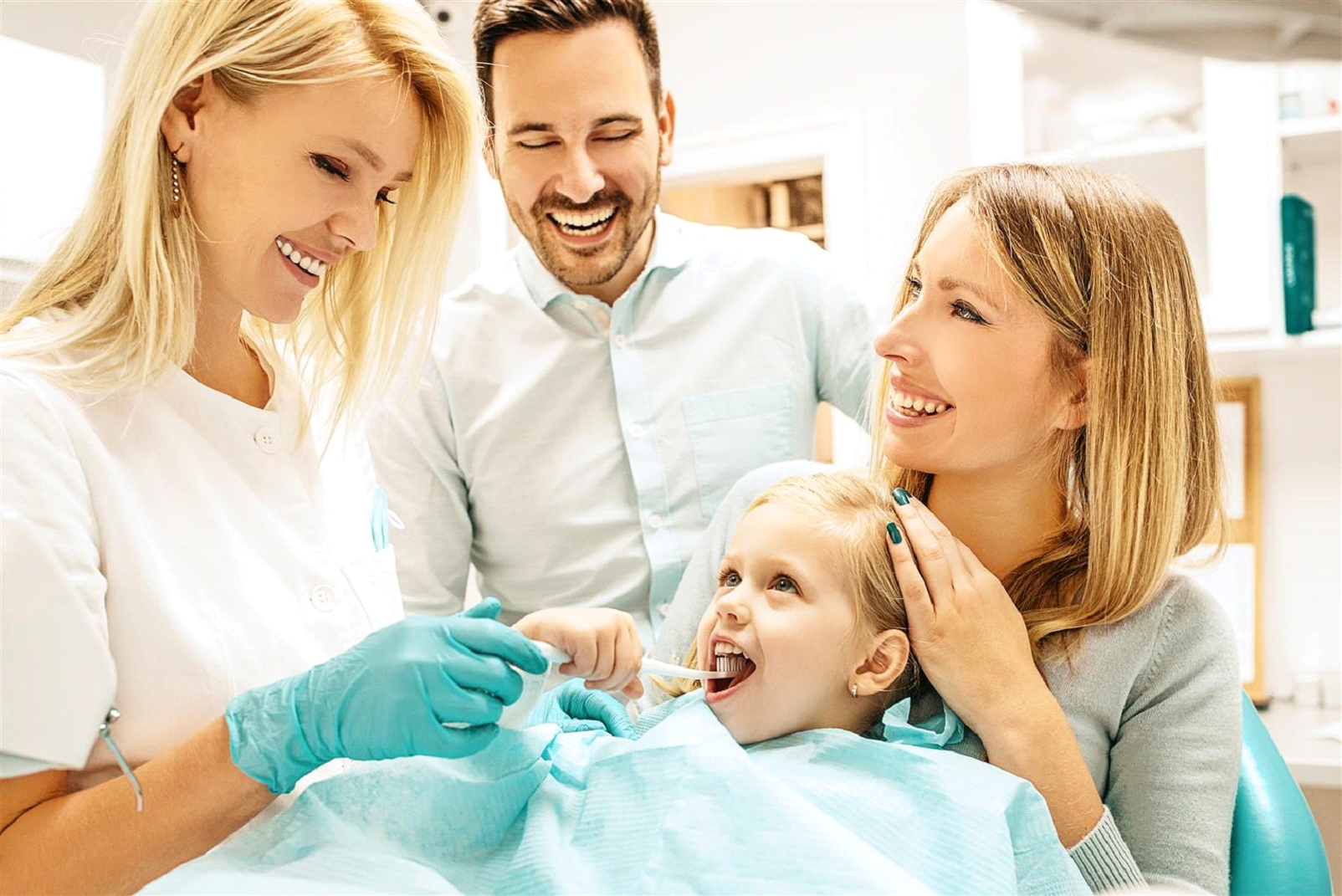 The family is so happy while the child is having her dental procedure